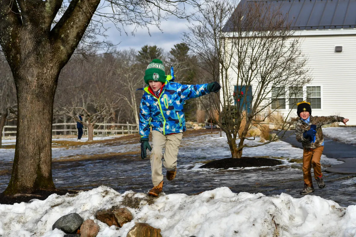 Boys play in the snow at Sparhawk Academy