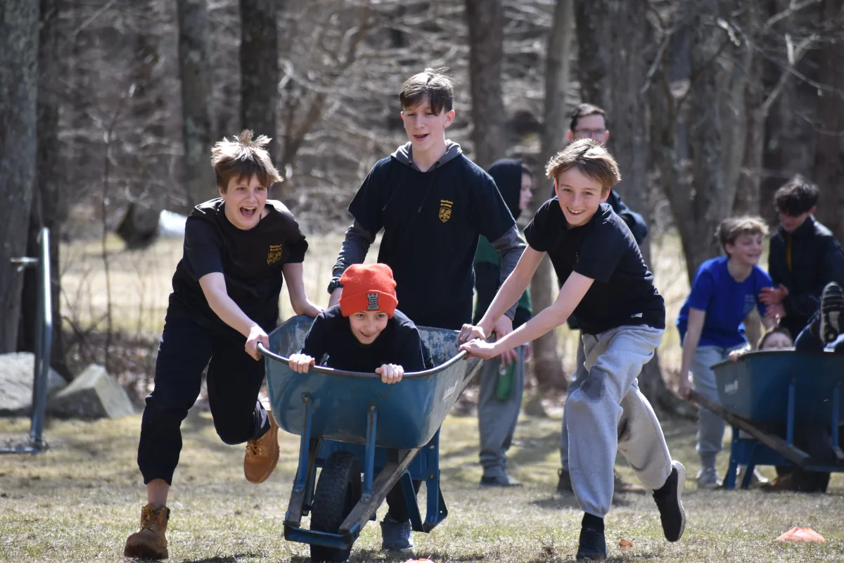 Mead Hall students in a wheelbarrow race