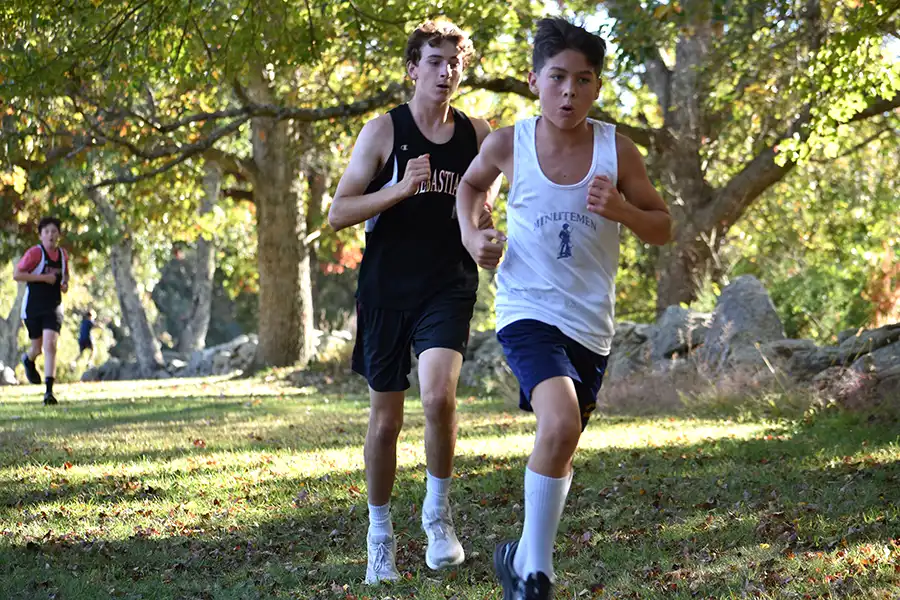 Male students cross training in fields