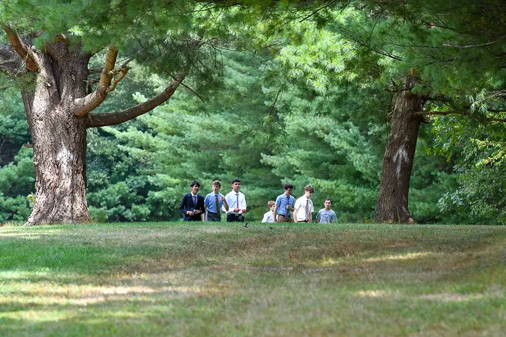 Sparhawk grade 9 students walking in field