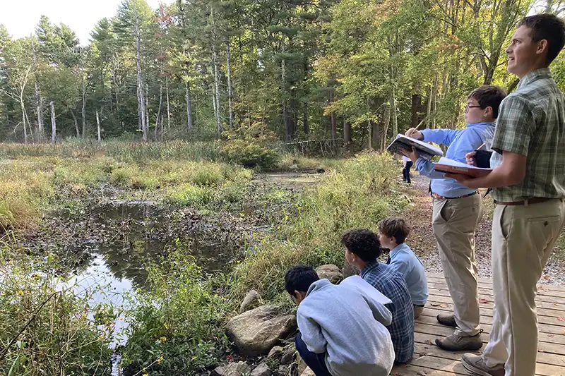Middle School male student writing