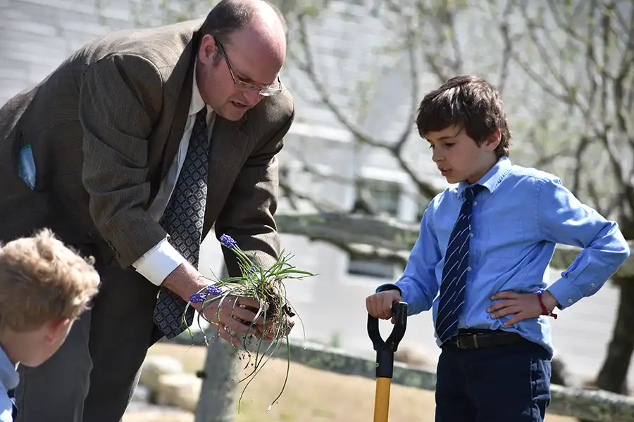 Sparhawk teacher planting with student