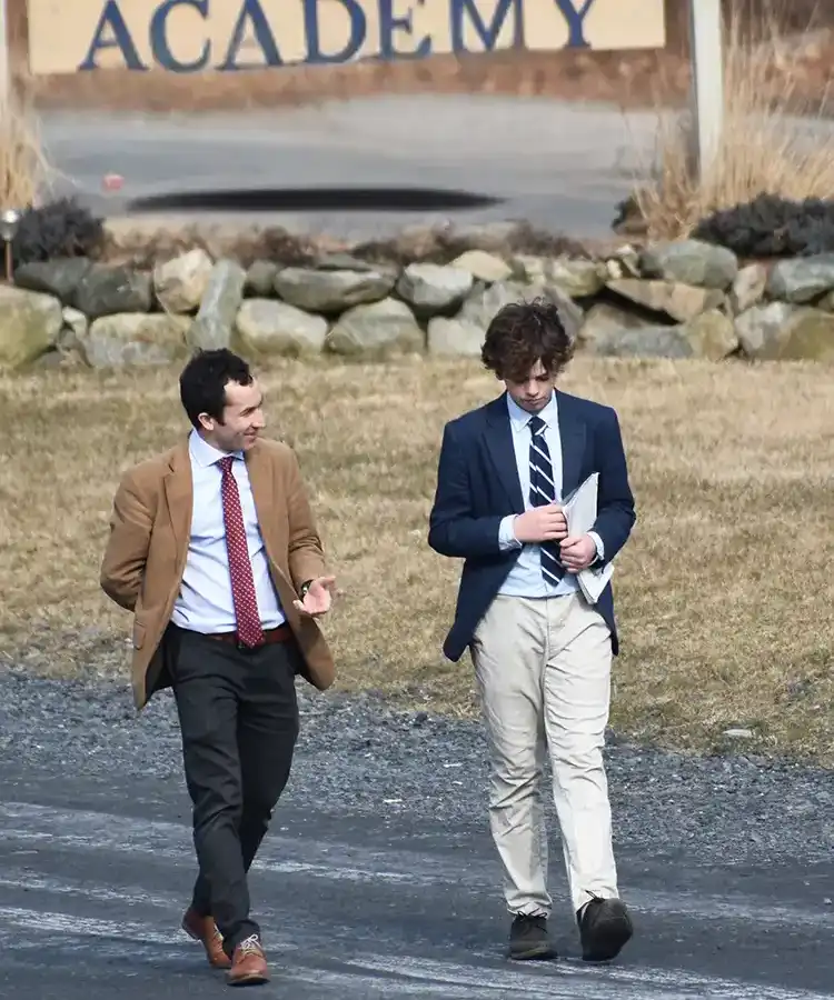 Teacher and student walking outside
